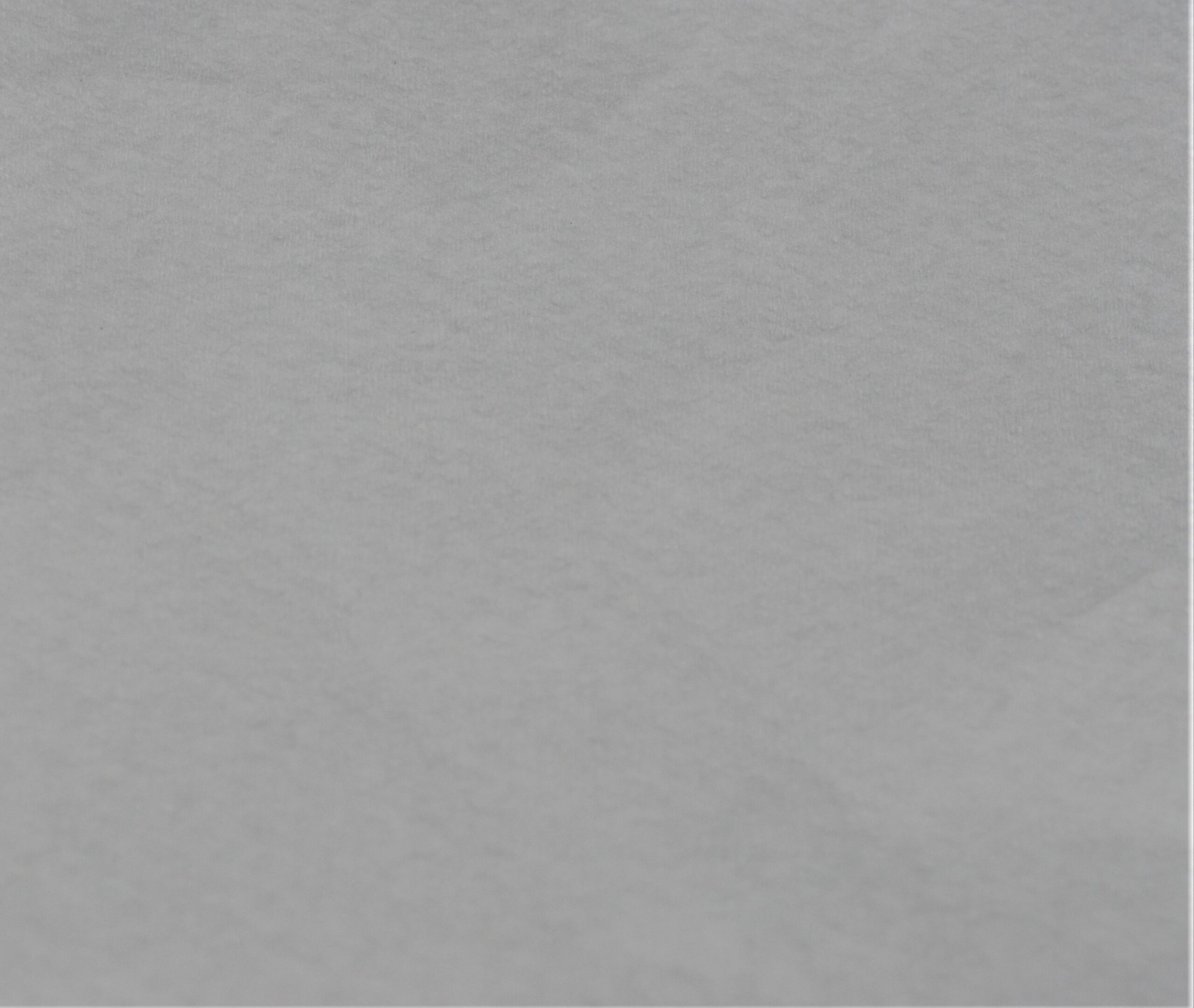 DRC bonded cellulose Close-up photo of DRC (also called bonded cellulose) nonwoven material to show texture. This sample is white DRC.