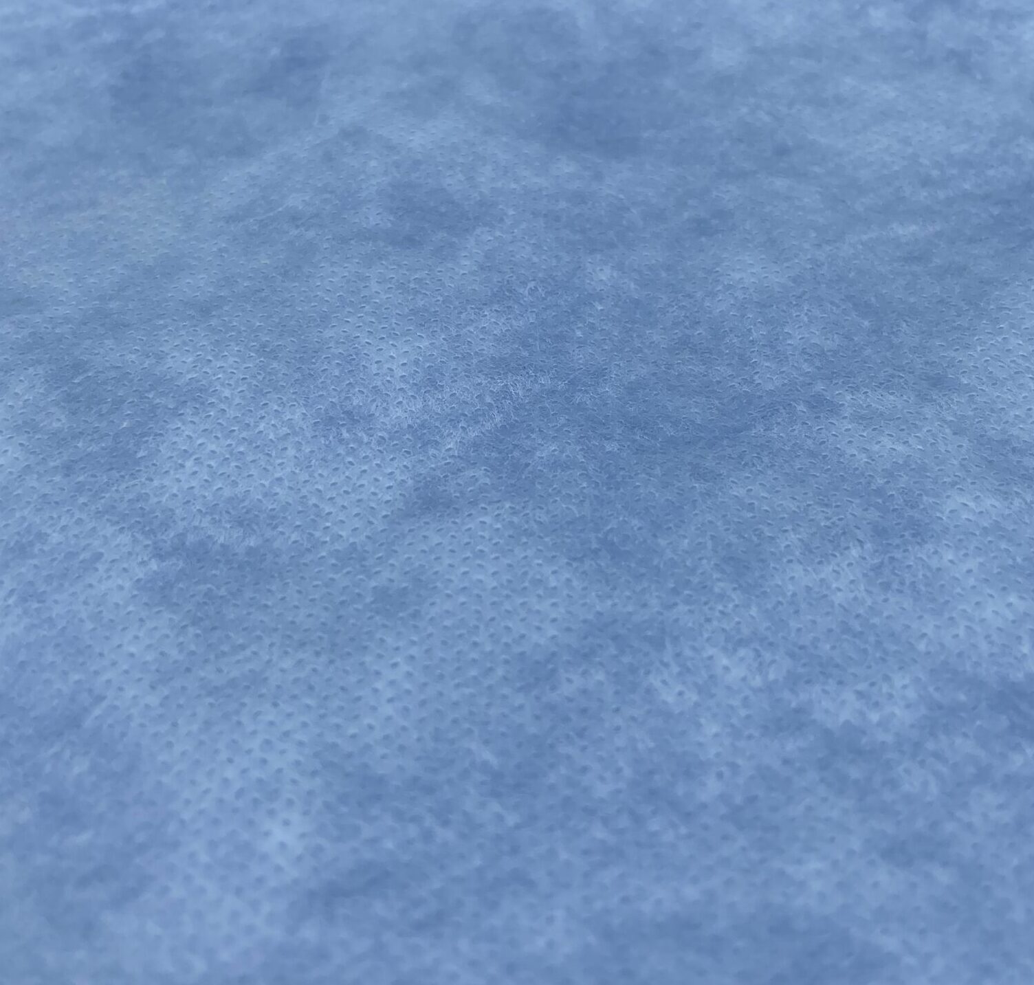spunbond polypropylene blue Close up photo of blue spunbond polypropylene nonwoven material to show texture